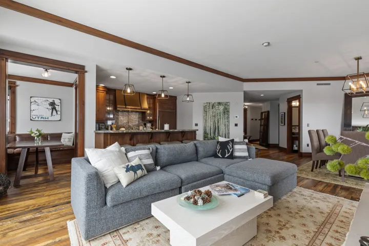 Expansive wood-finish flooring throughout, complemented by dark wood trim