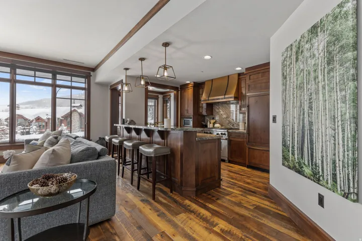 Open-concept living area with wood-finish flooring