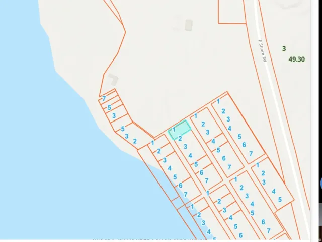 Title and Escrow Map. Depicting property boundaries, parcel numbers, and the location of the property relative to a body of water and local features