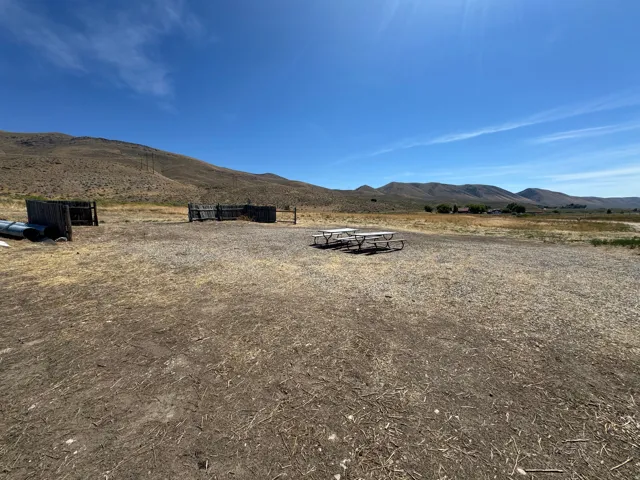 Expansive open land with distant mountain ranges