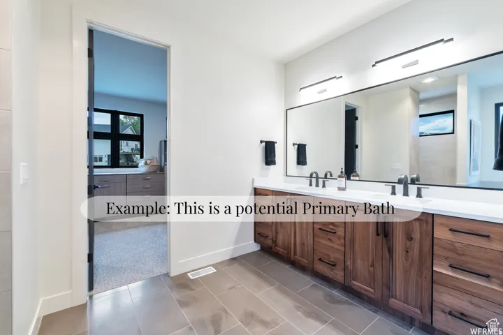 Dual vanity with wood-finish cabinetry and matte black hardware
