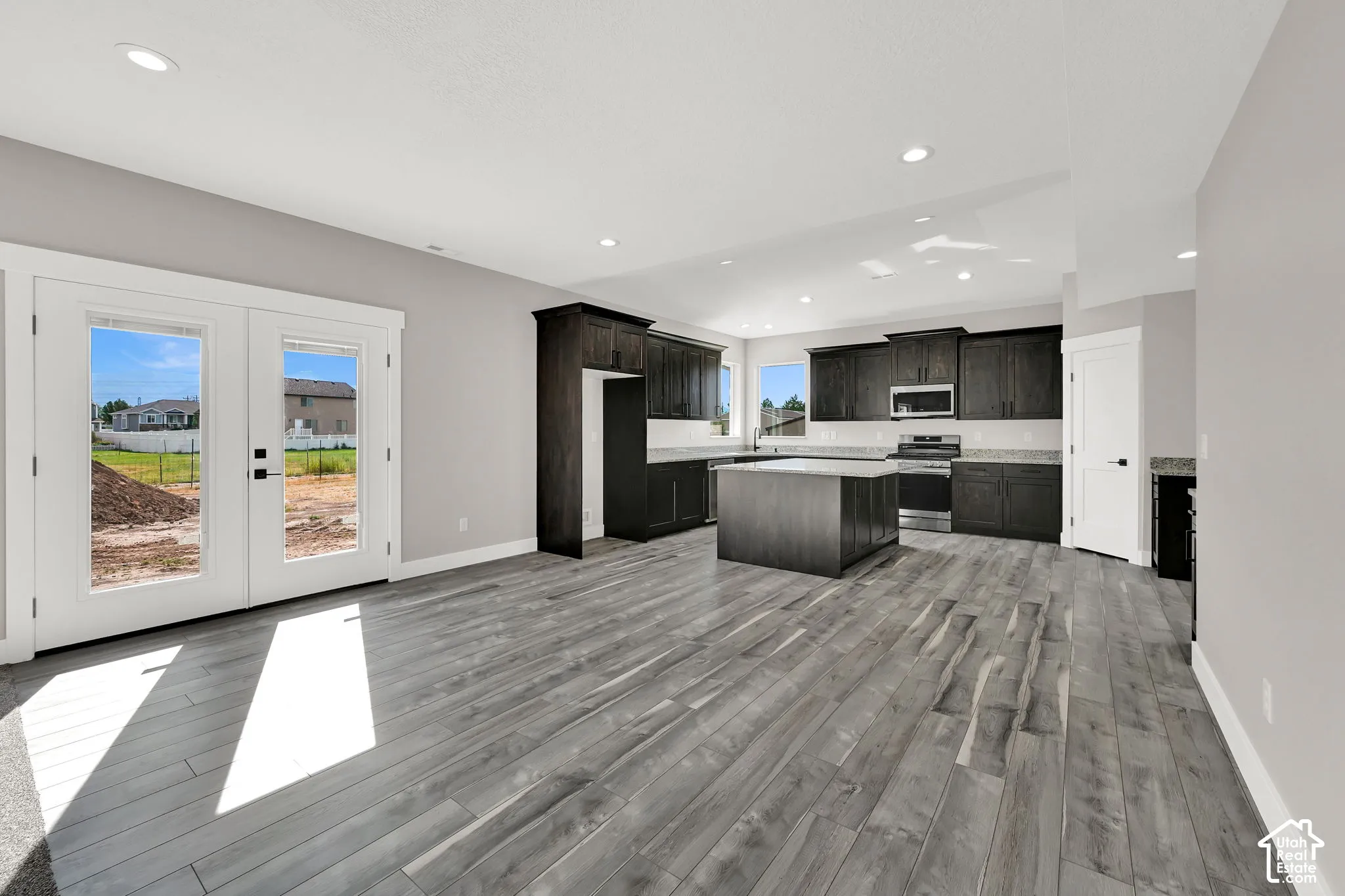 Large dining area - space for entertaining. Glass patio door leads to a wonderful east facing yard with mountain views.