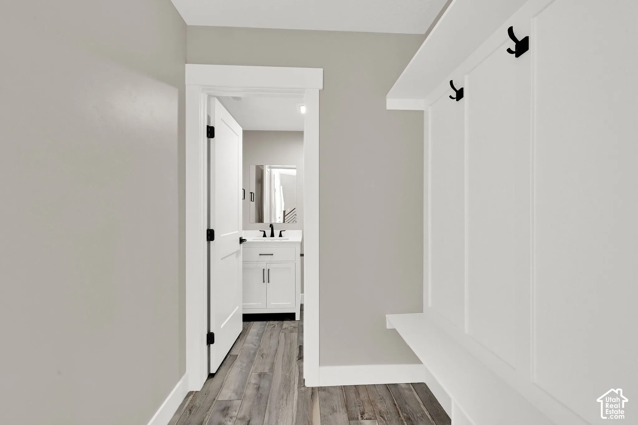 Mud room features a built-in bench and coat rack.