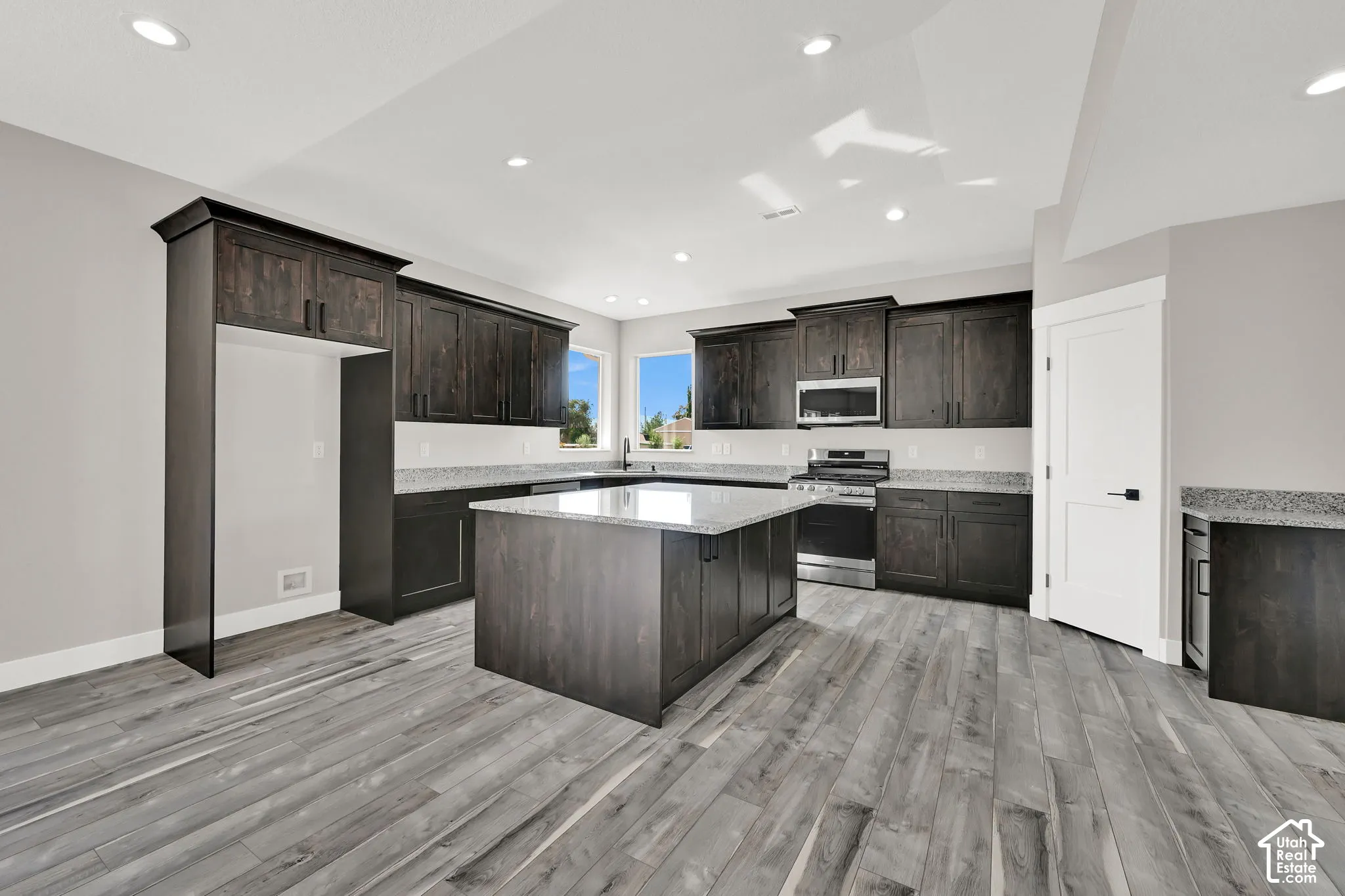 Tons of cabinets and a pantry provides amazing storge space.