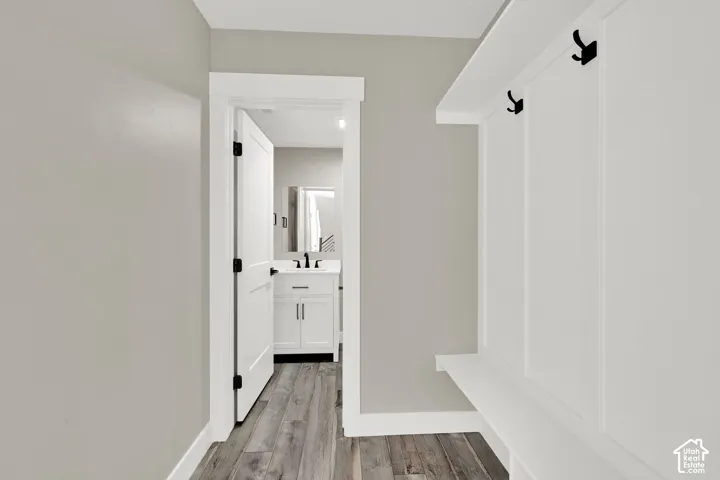 Mud room features a built-in bench and coat rack.