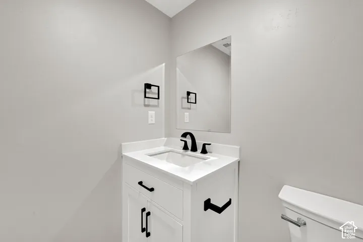 Powder room is conveniently located near the great room.