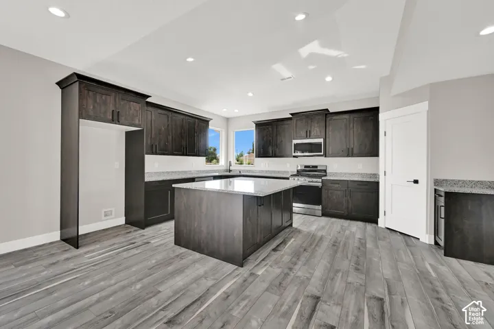 Tons of cabinets and a pantry provides amazing storge space.