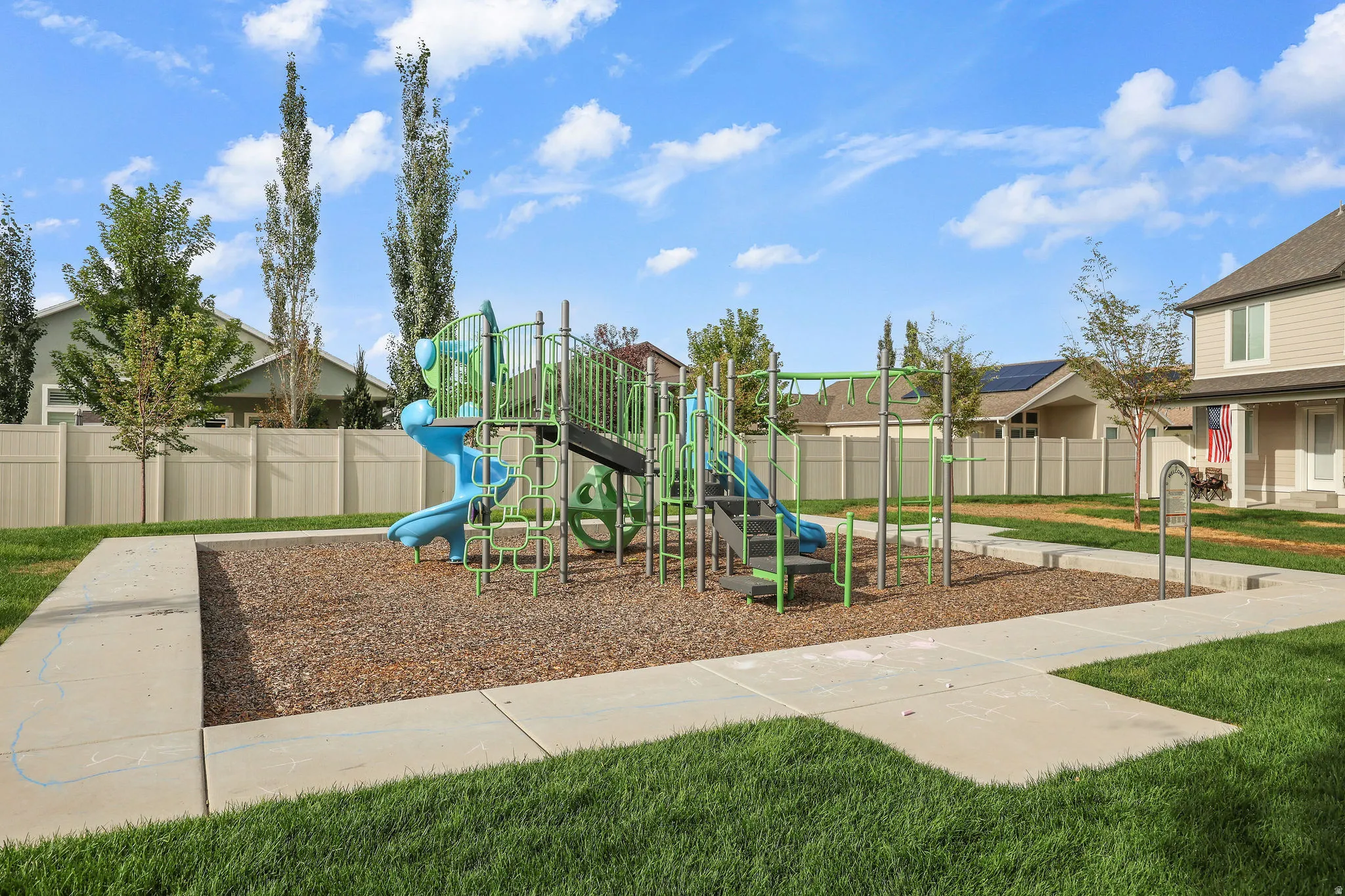 Playground structure featuring multiple slides and climbing elements