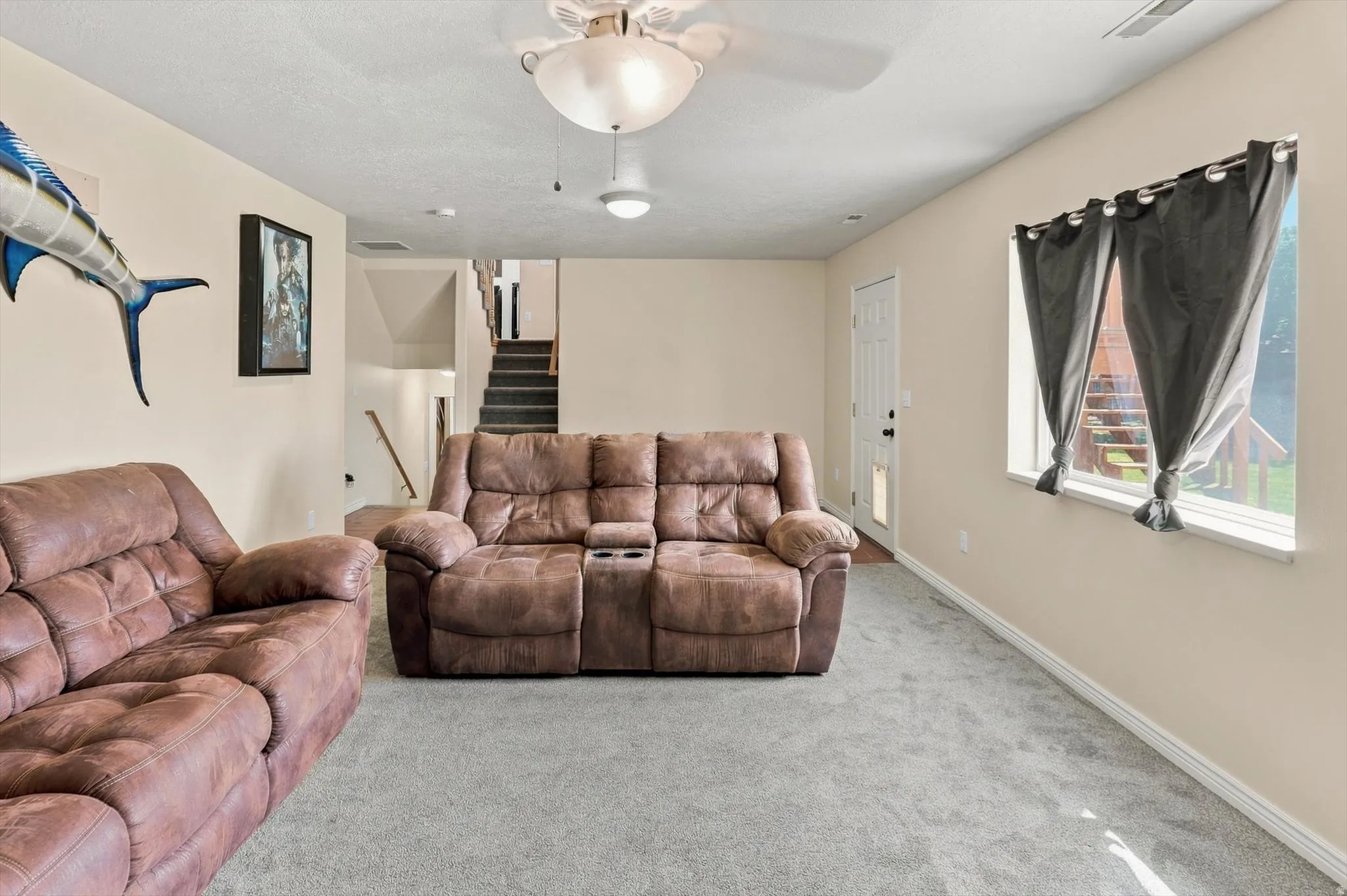 Carpeted flooring, recessed lighting, and a ceiling fan with integrated lighting
