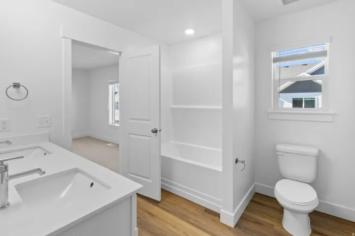 Primary bathroom will have single vanity sink and walk in shower