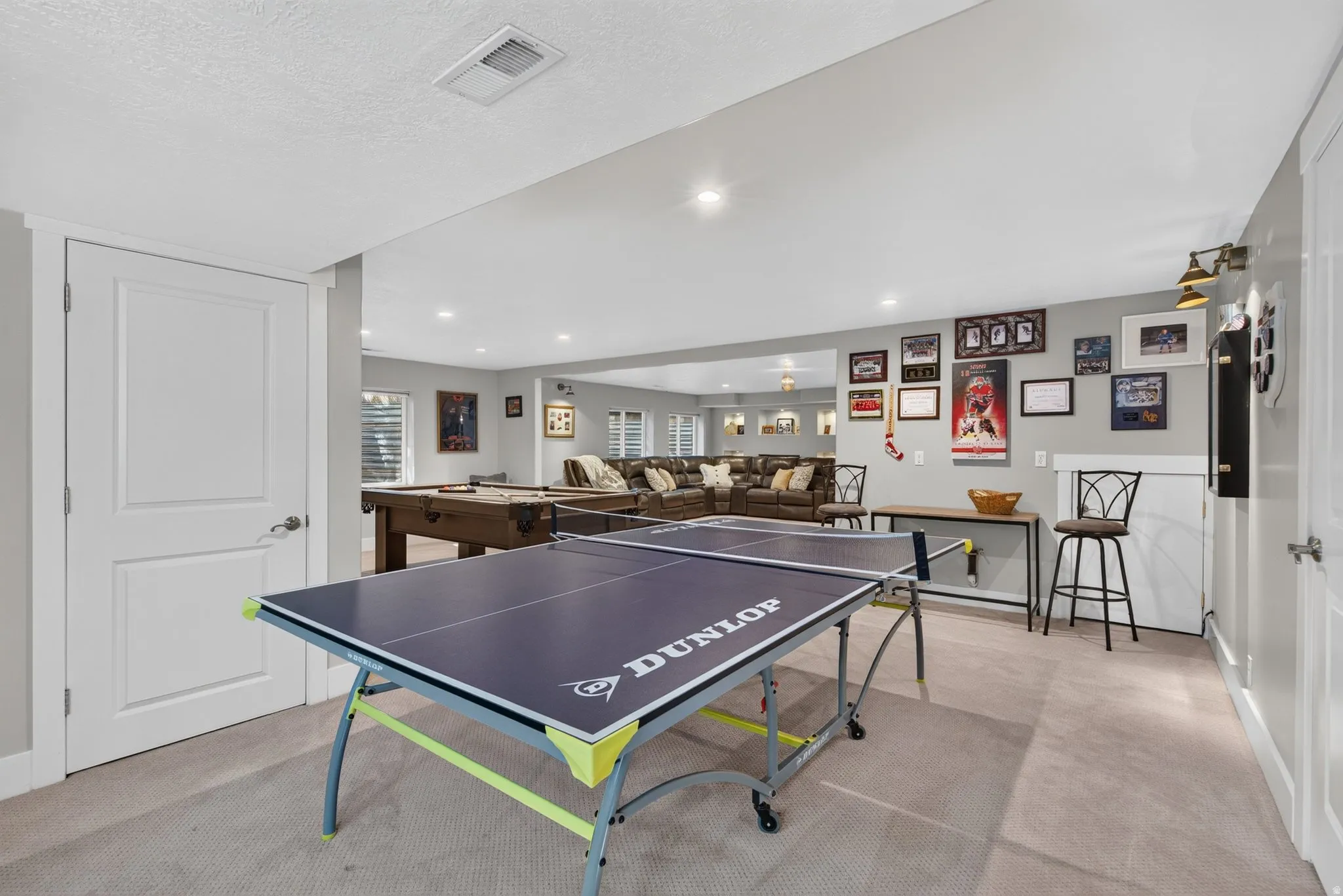 Expansive lower-level space featuring recessed lighting, light gray wall paint, and white trim
