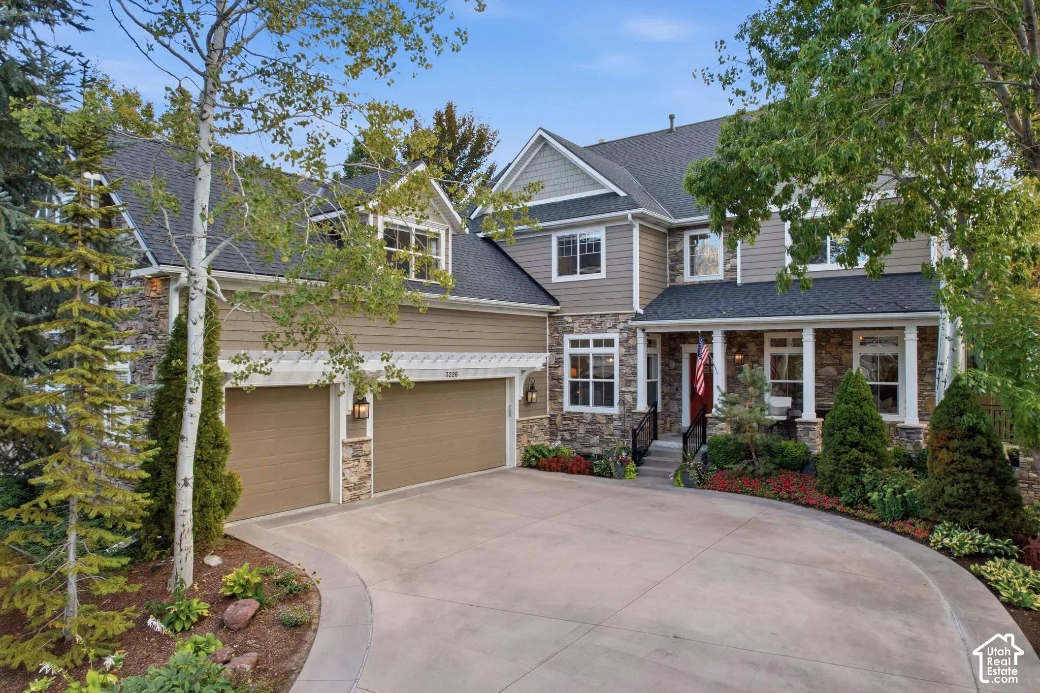 Stone and siding exterior with a covered porch