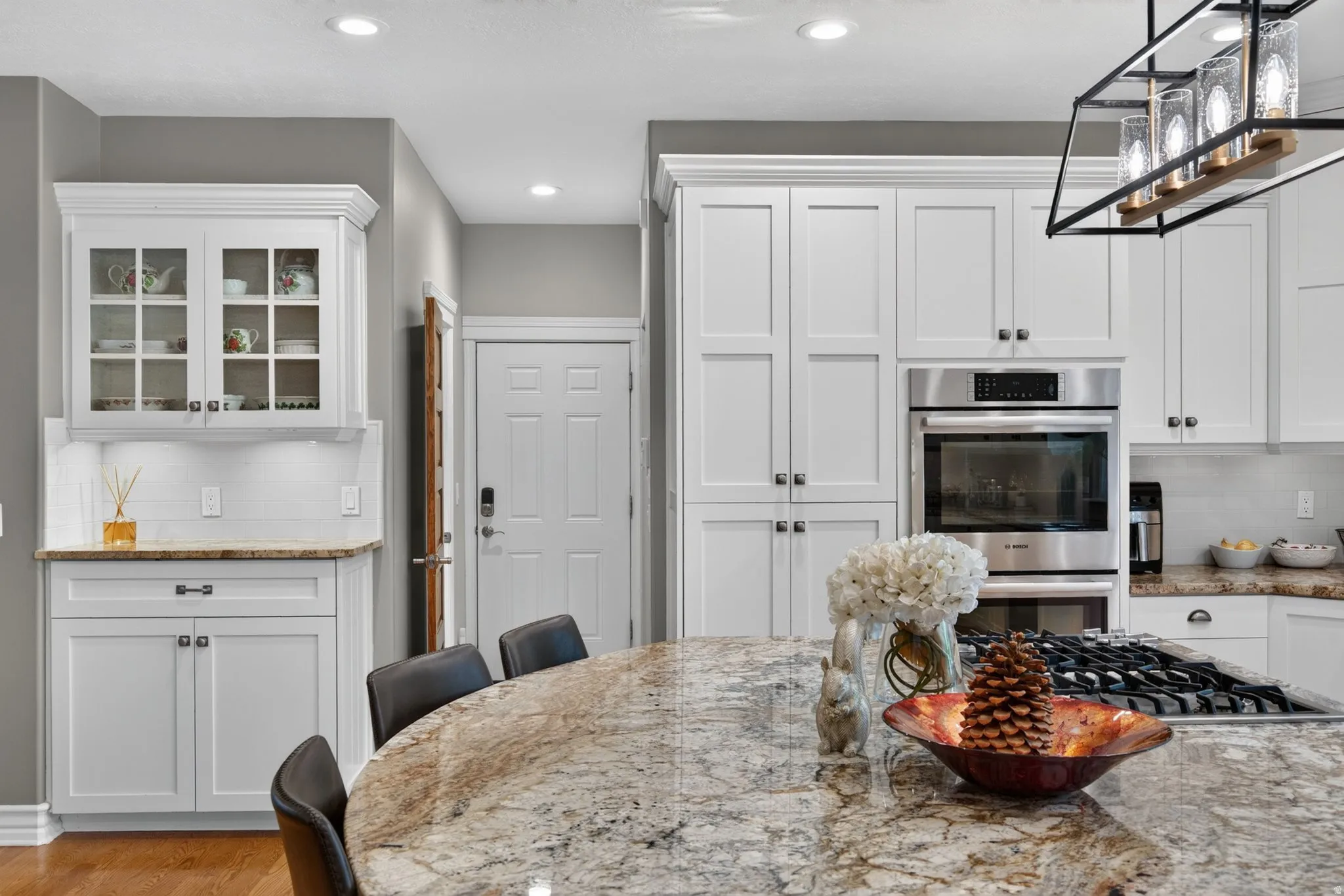 White shaker cabinetry paired with stainless steel appliances