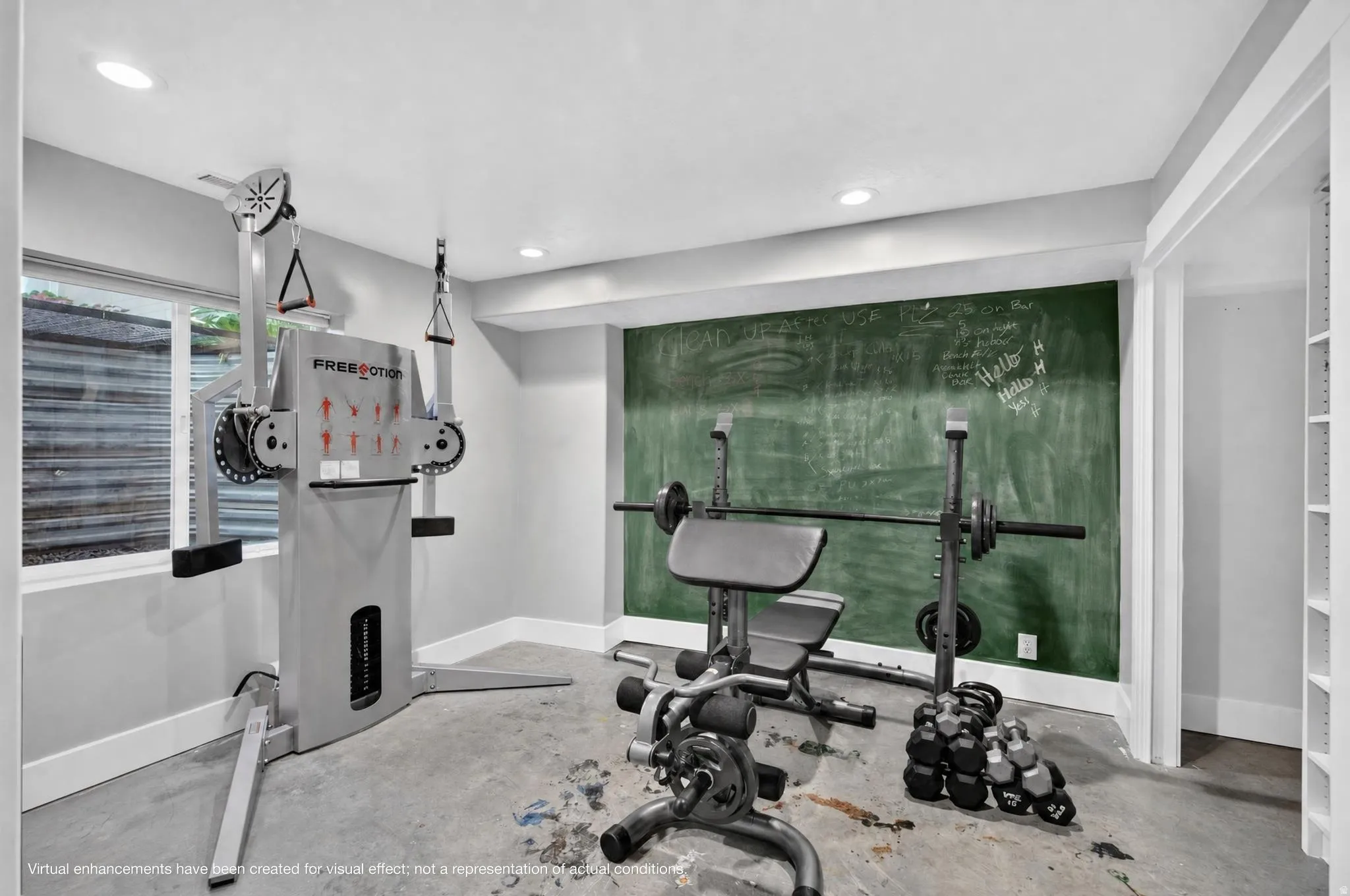 Recessed lighting, painted chalkboard wall, built-in shelving, window