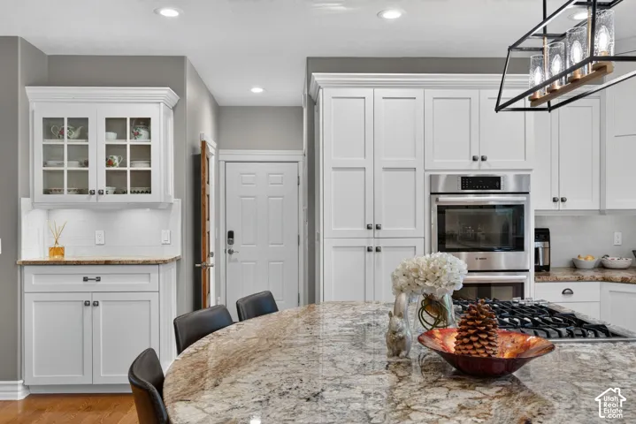White shaker cabinetry paired with stainless steel appliances