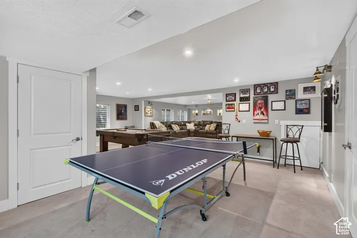 Expansive lower-level space featuring recessed lighting, light gray wall paint, and white trim