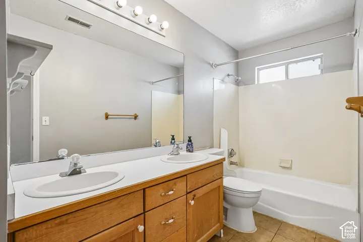 Dual basin vanity with wood-finish cabinetry