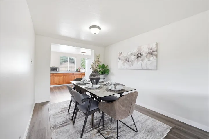 Wood-finish flooring throughout the dining area and kitchen