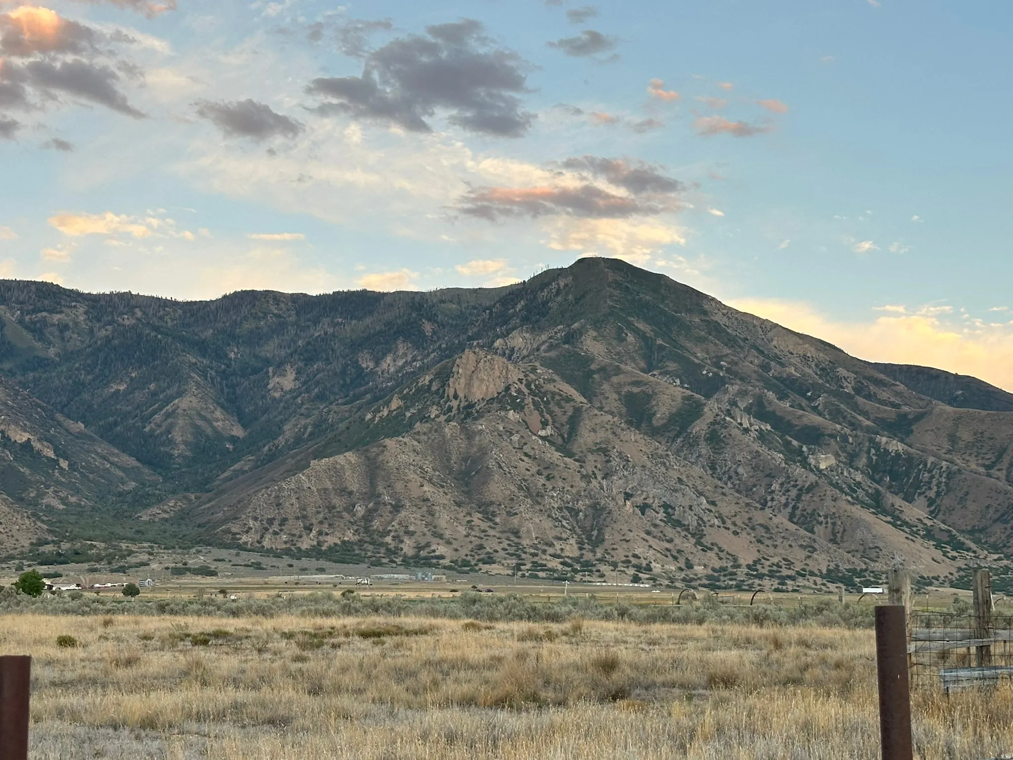 Mountain backdrop with natural terrain and distant structures