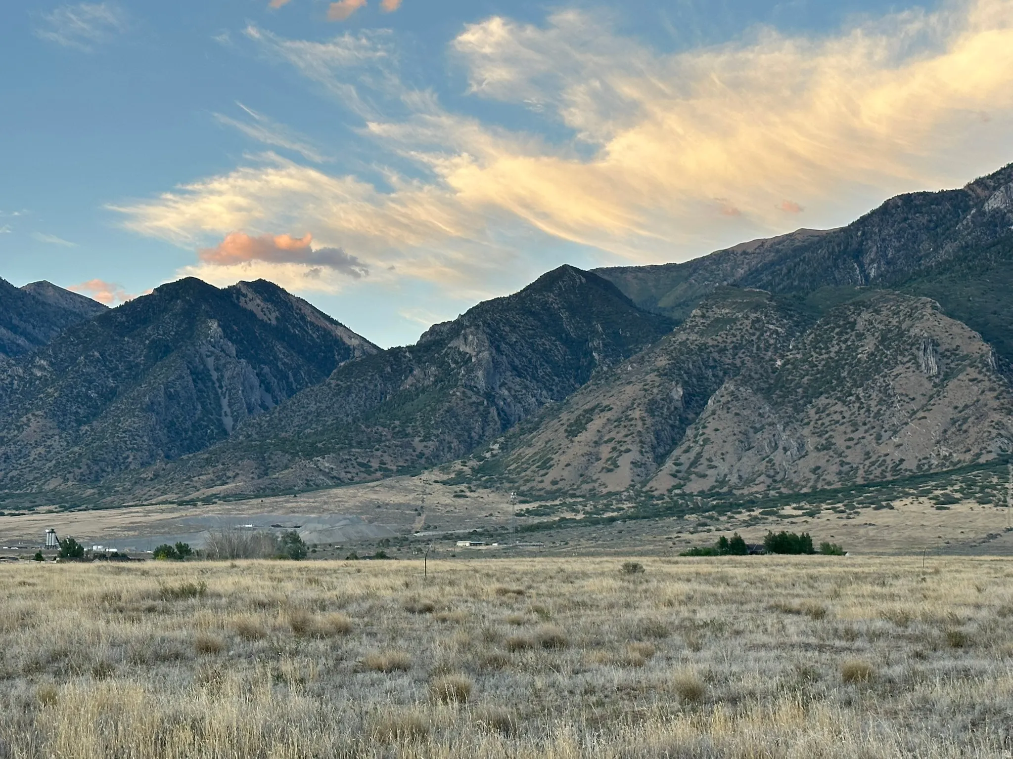 Expansive land parcel with prominent mountain backdrop
