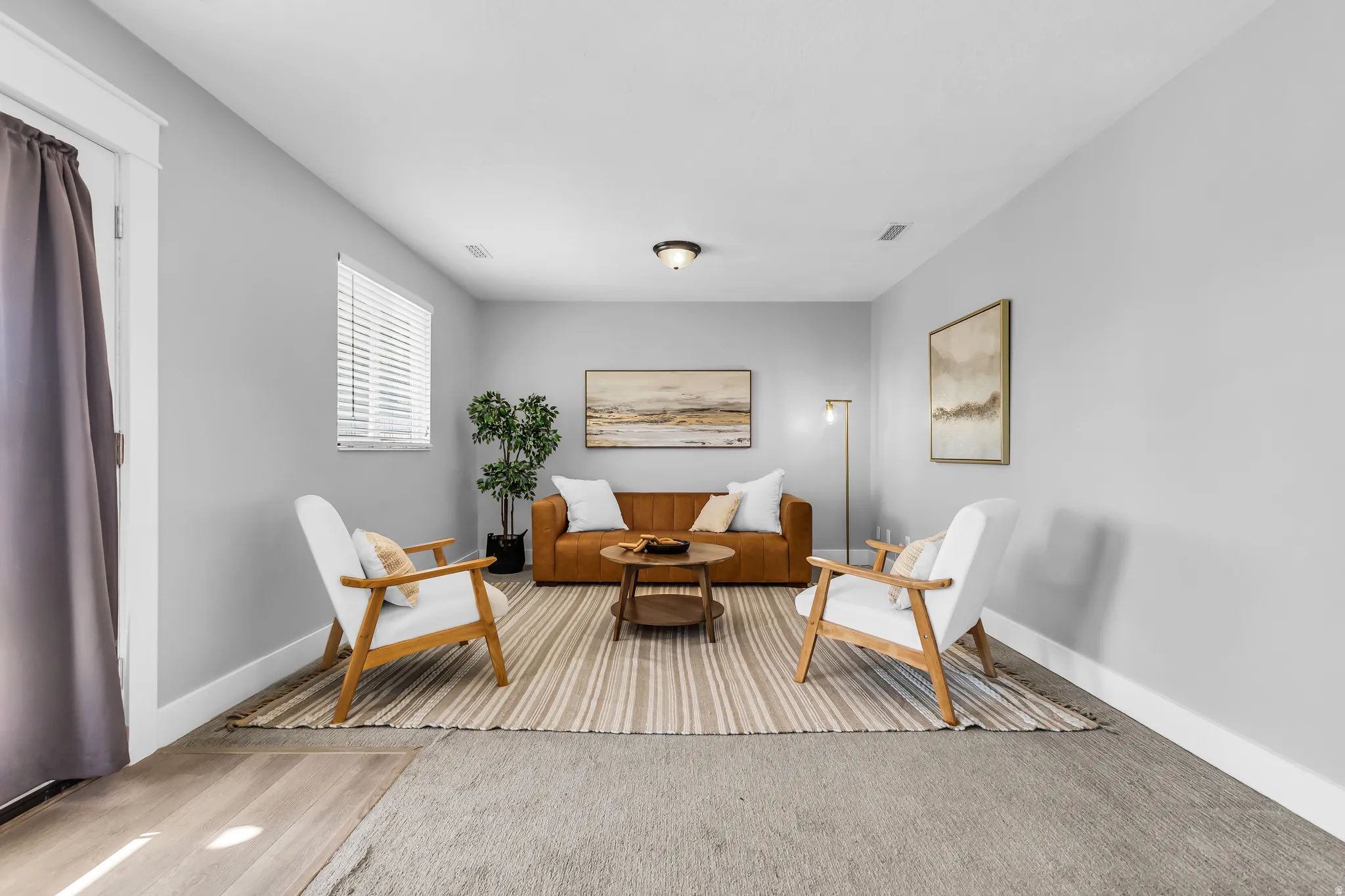 Neutral wall palette, recessed lighting, wood-finish flooring, white window blinds, and white trim