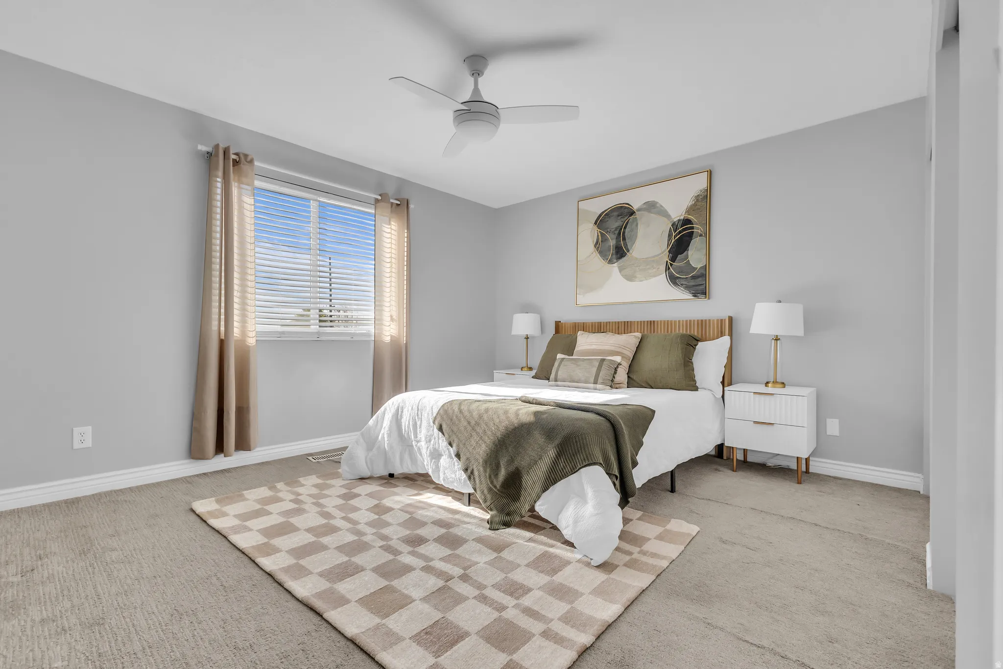 Window with blinds, wall-mounted light fixture, ceiling fan, and carpeted flooring