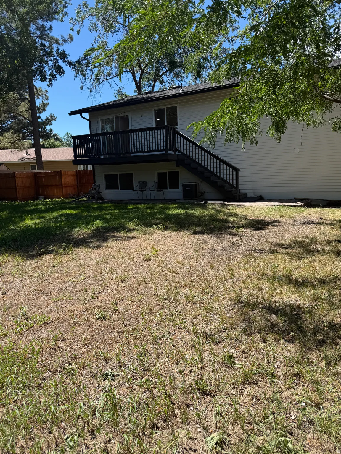 Exterior siding with a multi-level deck and staircase