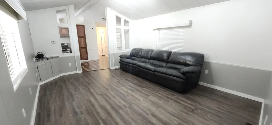 Wood-finish flooring throughout, complemented by a chair rail molding