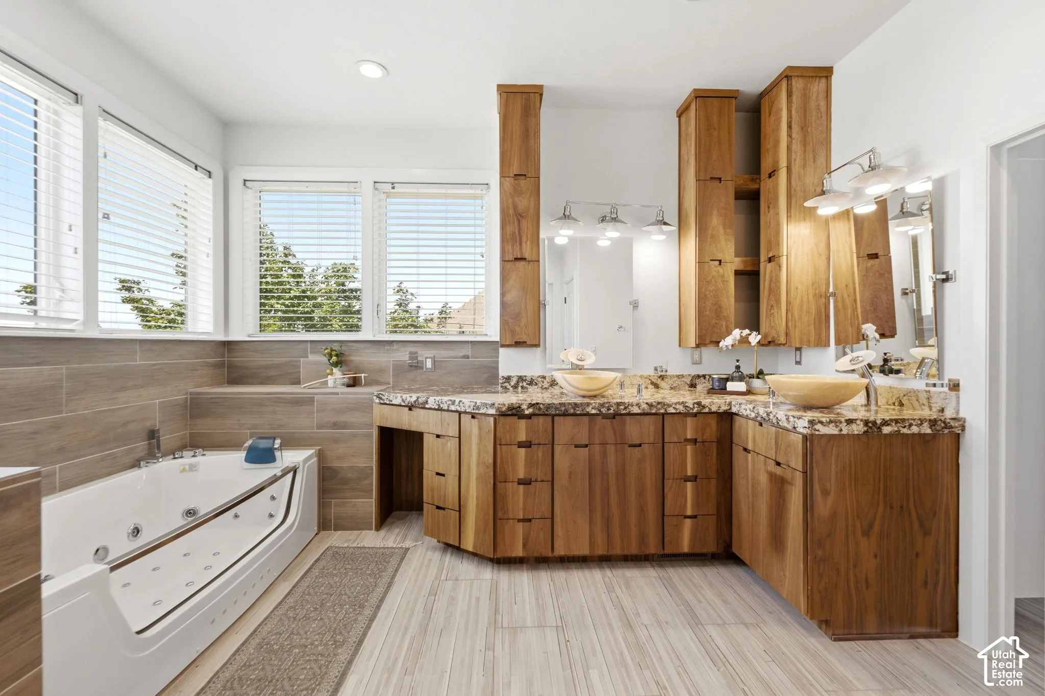 Dual vessel sinks with stone countertops