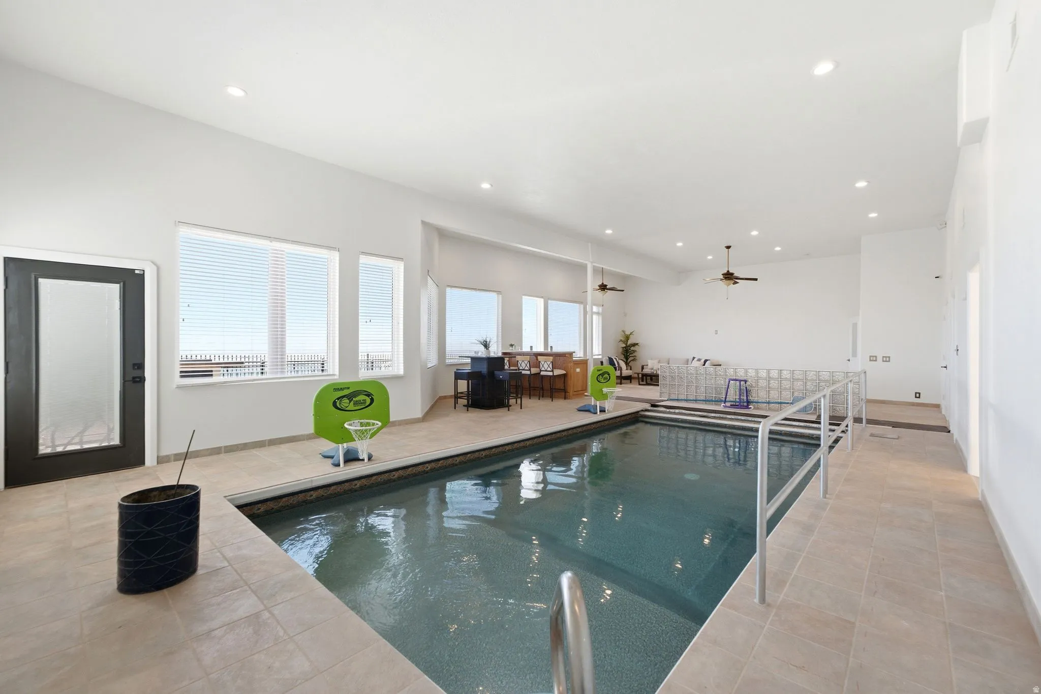 Indoor swimming pool with integrated steps and handrails