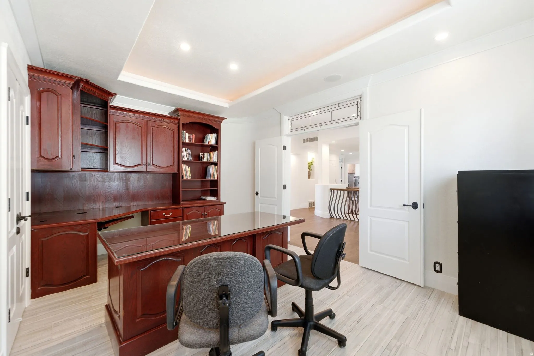 Built-in wood cabinetry with integrated shelving and desk