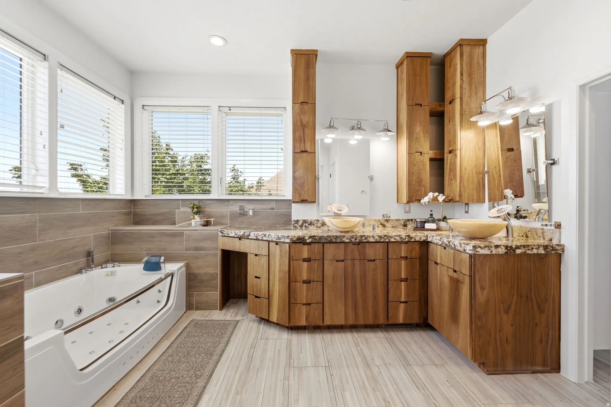 Dual vessel sinks with stone countertops