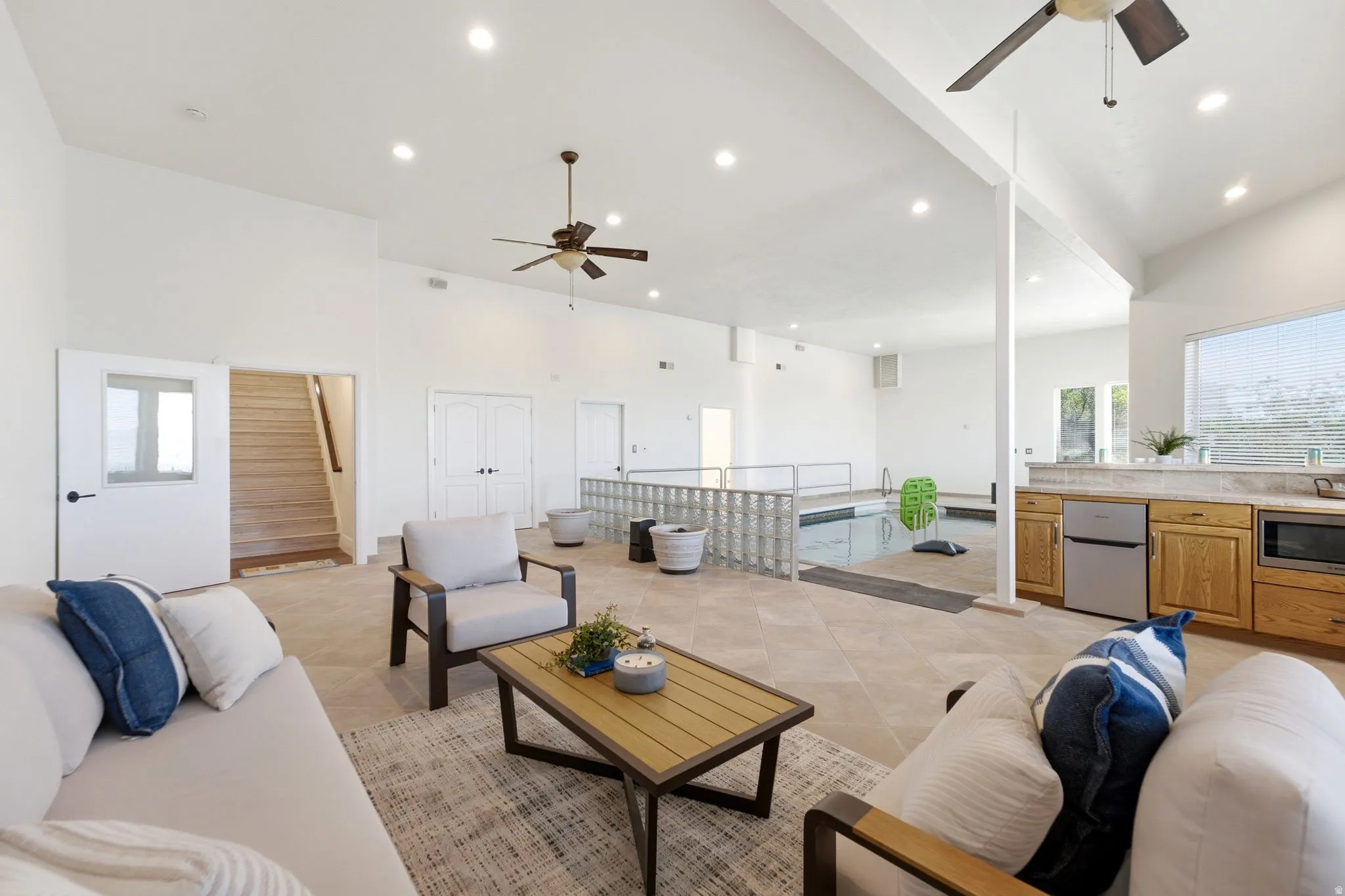 Recessed lighting, vaulted ceiling, and an indoor swimming pool