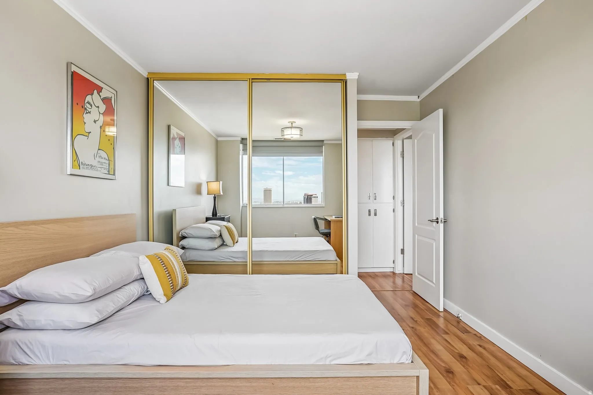 Mirrored closet doors with gold-finish frames