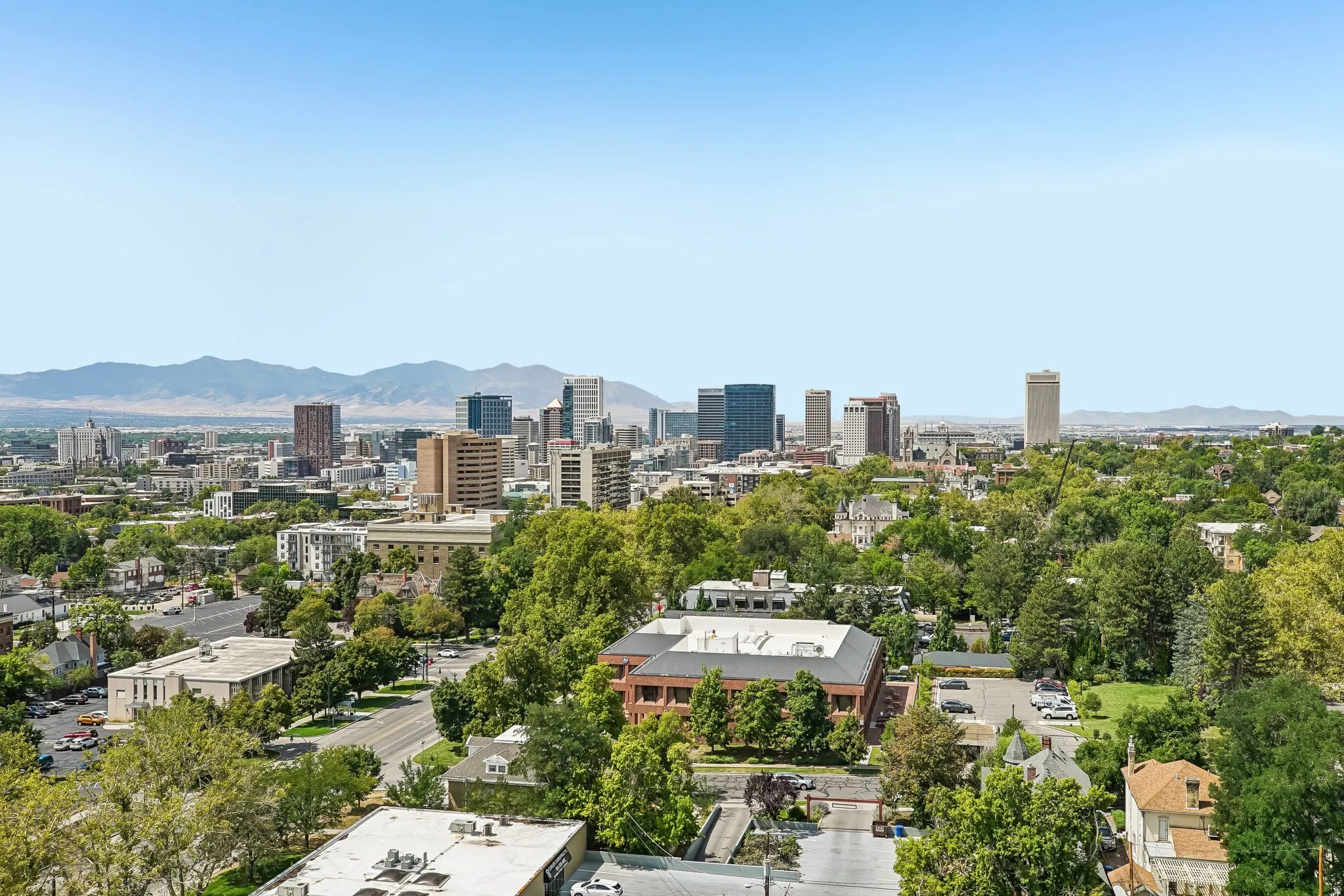 Expansive city skyline with distant mountains