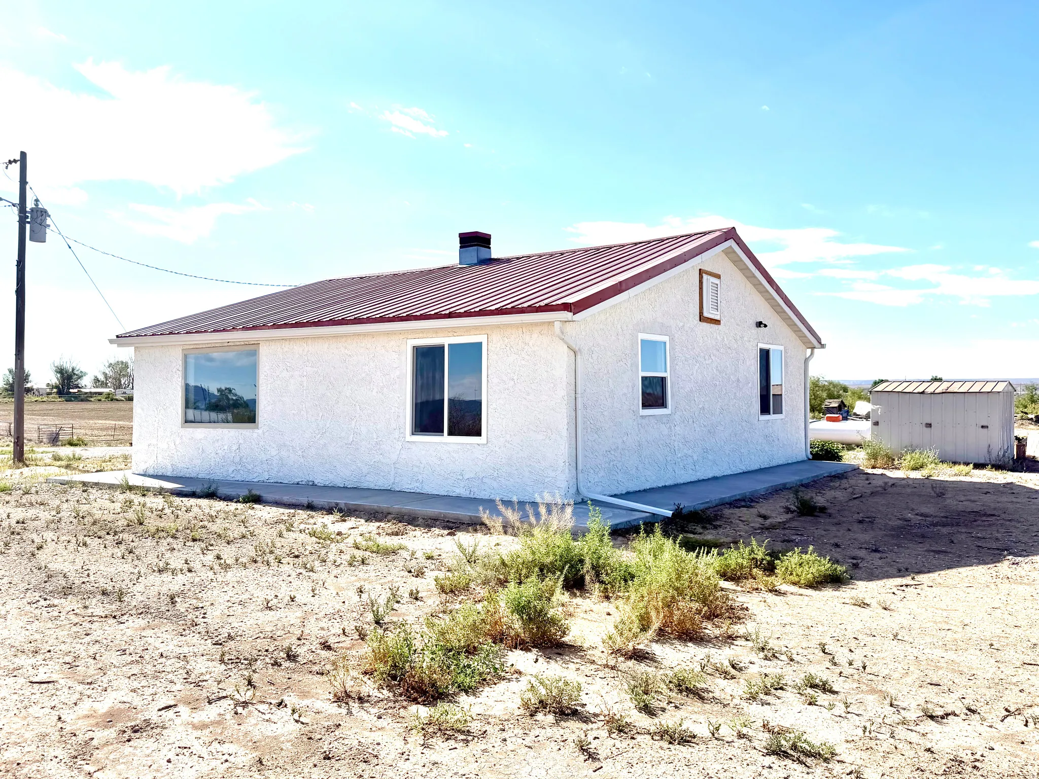 New Windows, Metal Roof, Raingutters, & Concrete Sidewalks!