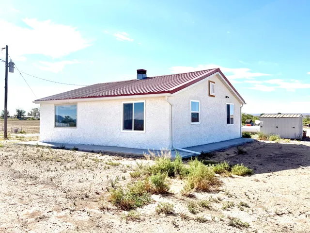 New Windows, Metal Roof, Raingutters, & Concrete Sidewalks!