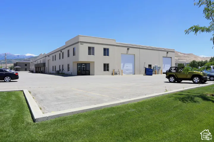 Expansive paved lot with mature landscaping