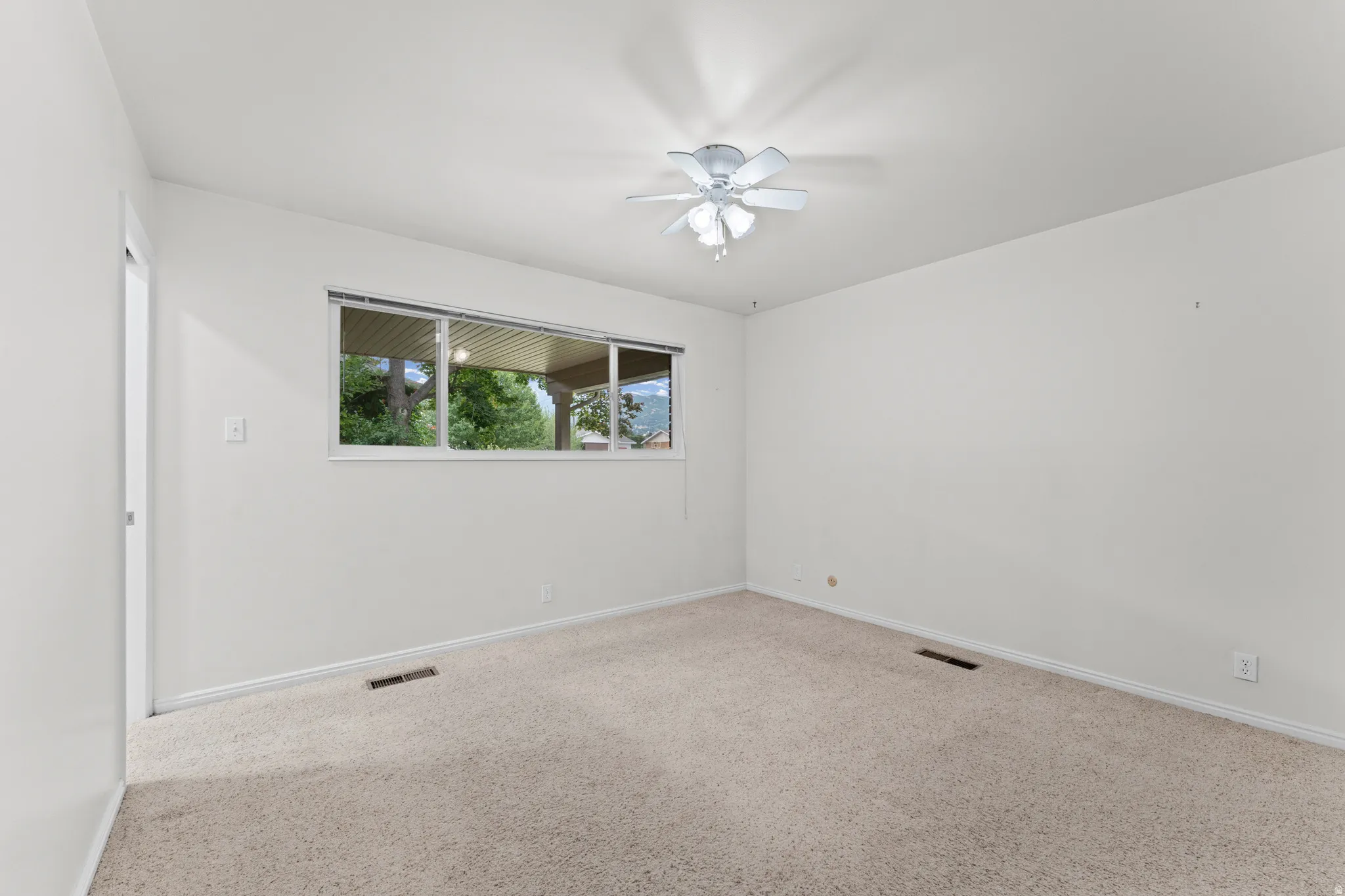 Neutral wall finishes and carpeted flooring