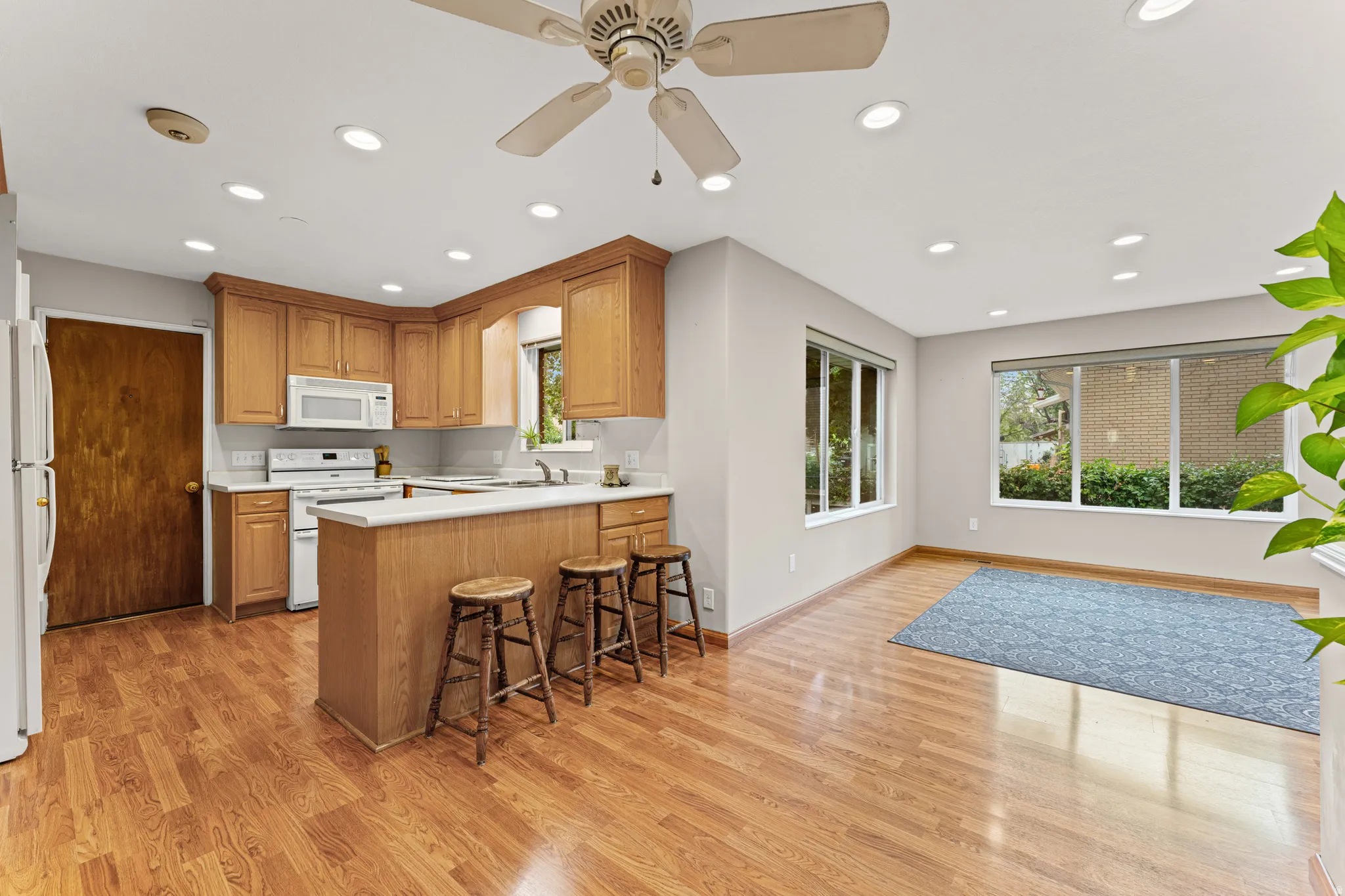 Open-concept living space with wood-finish flooring