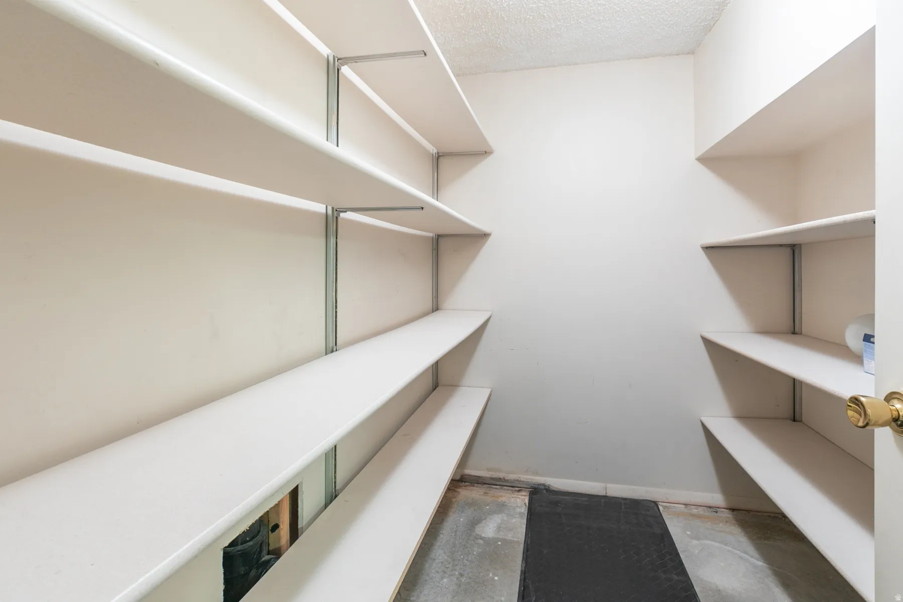 Adjustable shelving system with white shelves