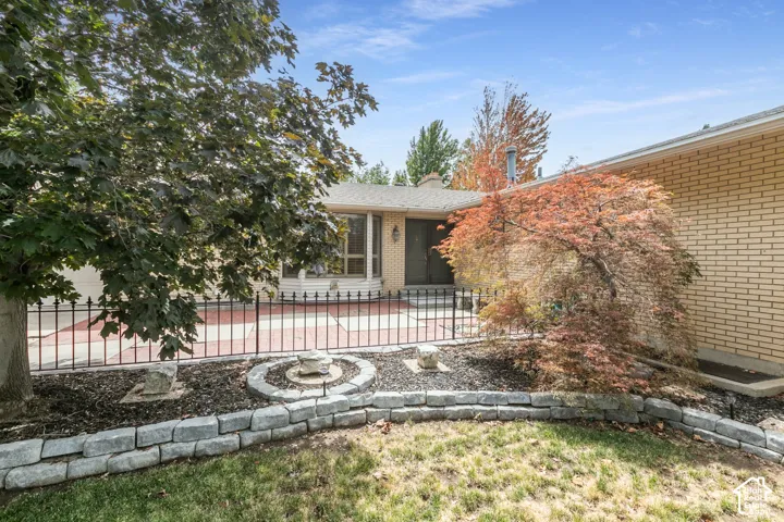 Brick exterior with a gabled roof and front entry
