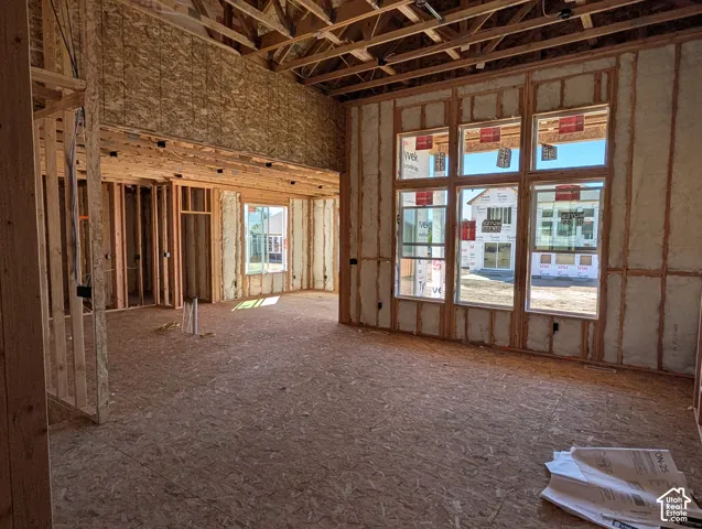 New construction framing with high ceilings and multiple windows