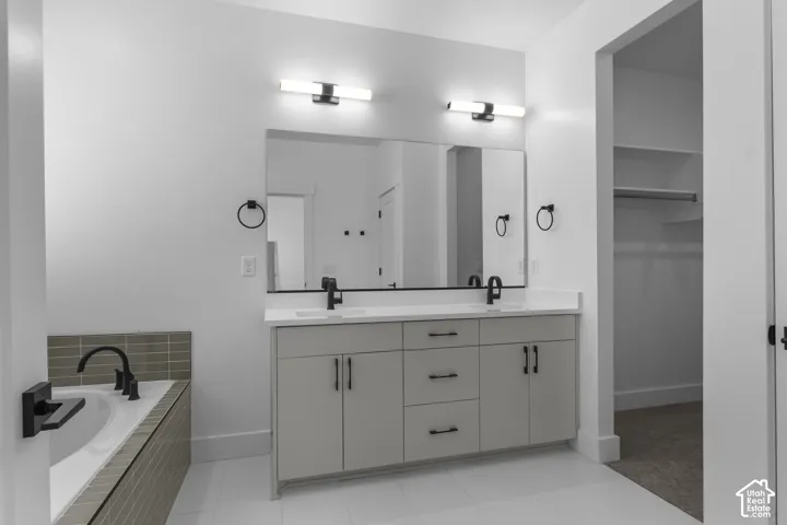 Dual vanity with integrated sinks, white countertops, and matte black fixtures