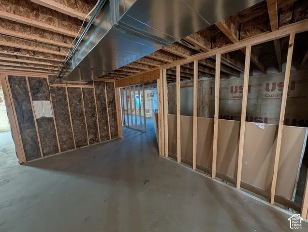 Framed interior walls with insulation and exposed ceiling joists