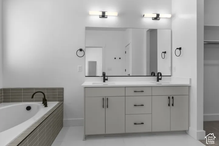 Dual vanity with a white countertop and matte black fixtures