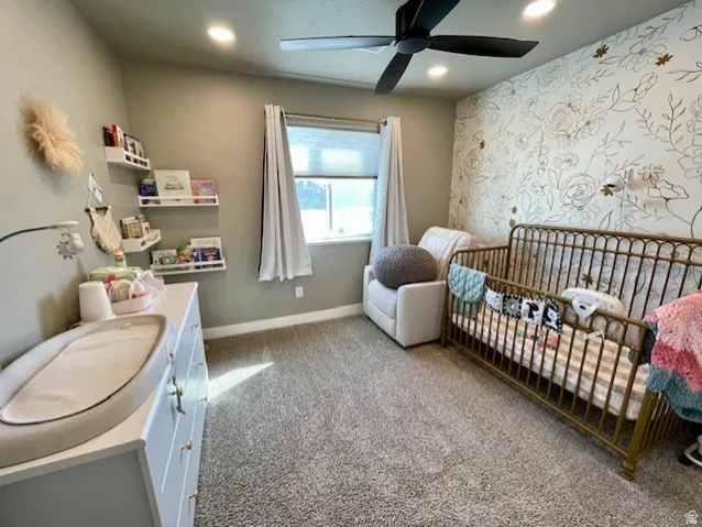 Bedroom # 3; Wall-to-wall carpeting, recessed ceiling lighting, and a ceiling fan with integrated lighting
