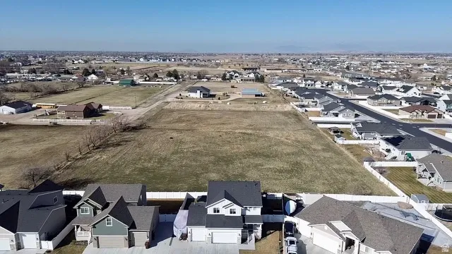 No neighbor behind for added views and privacy!  Expansive undeveloped land parcel with surrounding residential properties and distant horizon