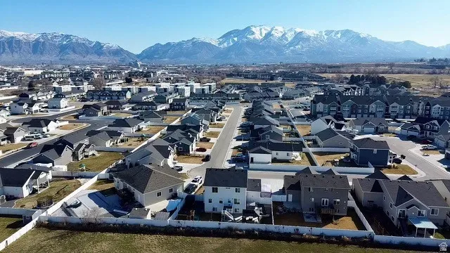 Gorgeous mountain views from this neighborhood; Residential community featuring paved streets, individual homes with fenced backyards, and distant mountain backdrops