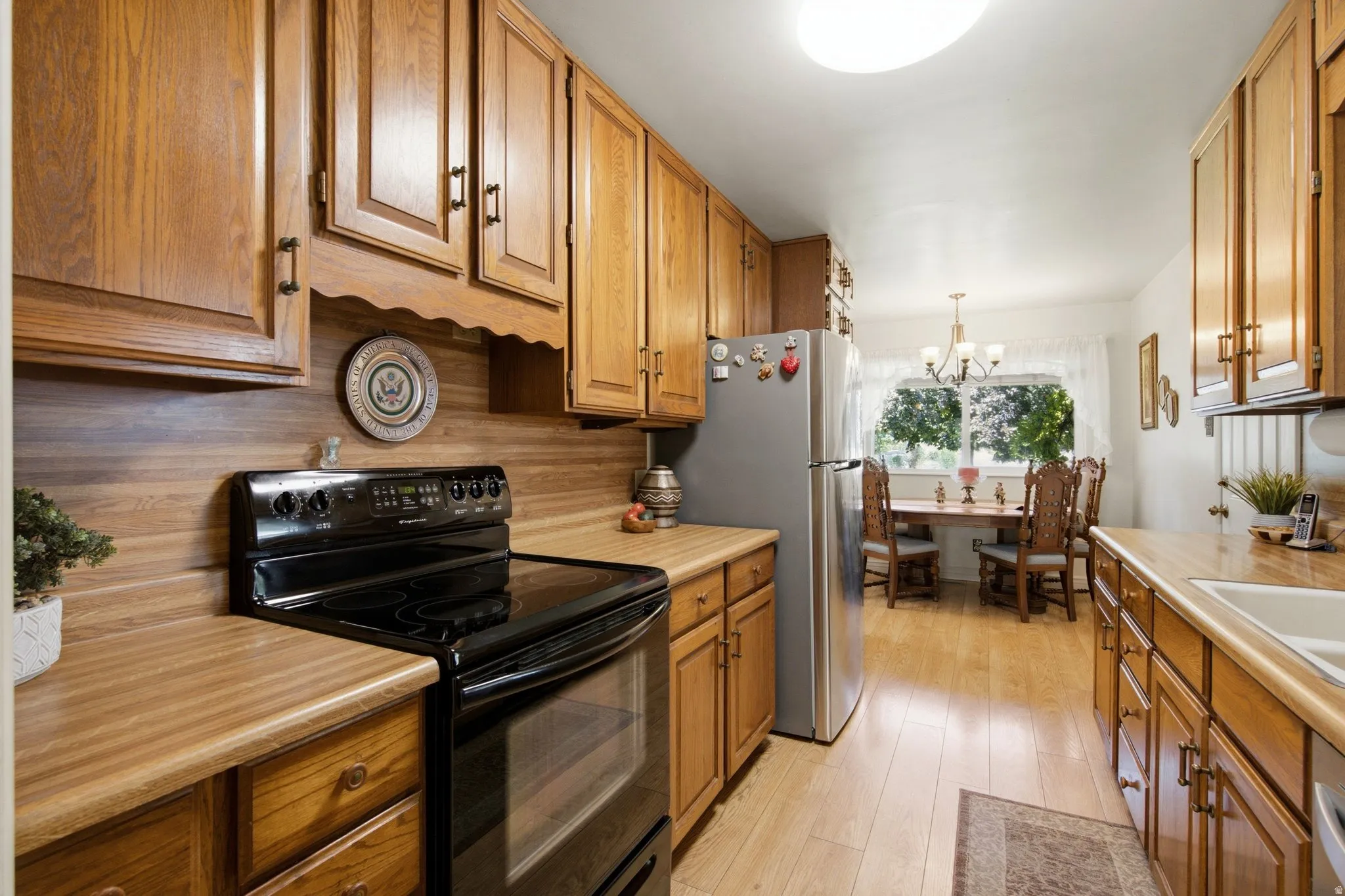 Wood-finish cabinetry paired with complementary countertops